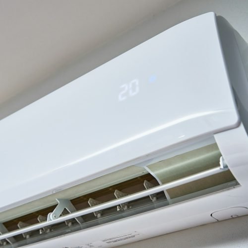 Air conditioner hanging on the wall, close up Air conditioner hanging on the wall, close up
